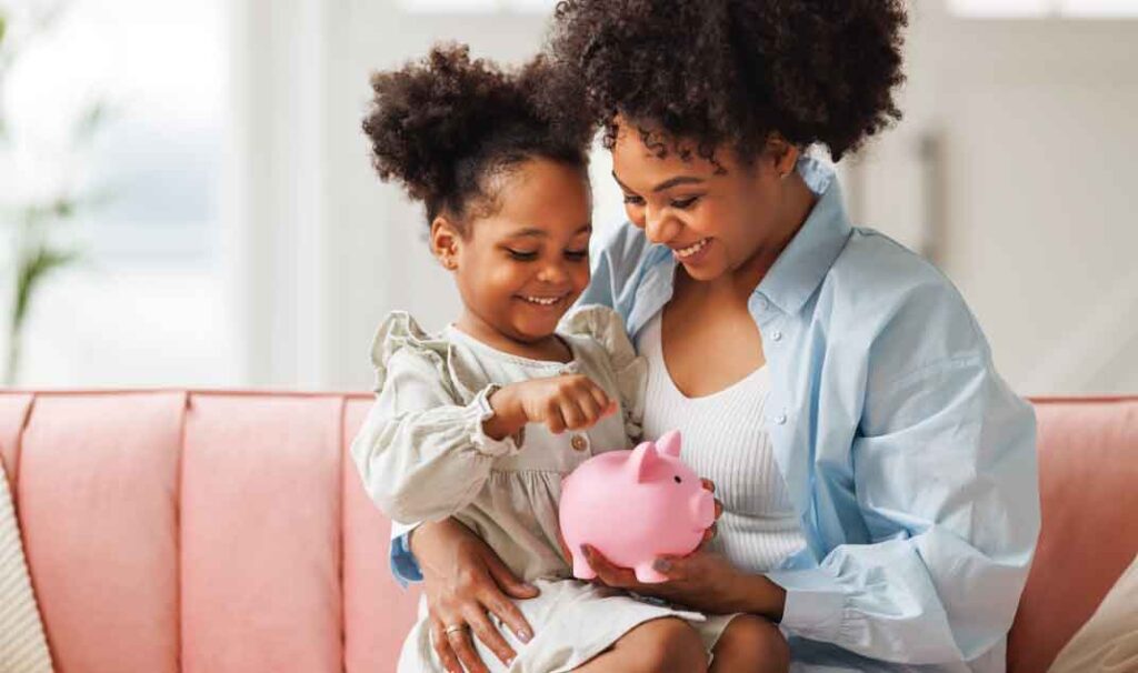 Mother and daugther and piggy bank